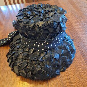 Woven "straw" hat in black with a black and white dotted ribbon.
